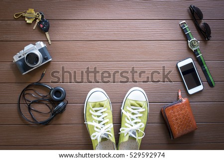 Travel objects on wooden background top view Royalty-Free Stock Photo #529592974