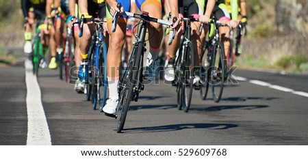 Cycling competition,cyclist athletes riding a race at high speed Royalty-Free Stock Photo #529609768