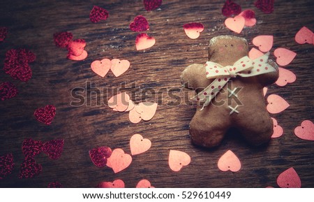 Gingerbread man and heart on a dark background. Studio shooting. Subject shooting.