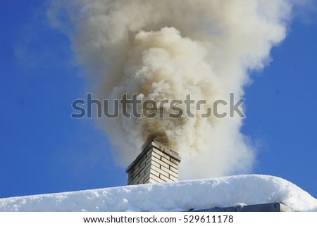 Dense smoke from a chimney house