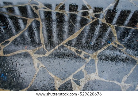 black wet granite tiles with water drops pile of granite texture - marble layers design gray stone slab surface grain rock backdrop layout