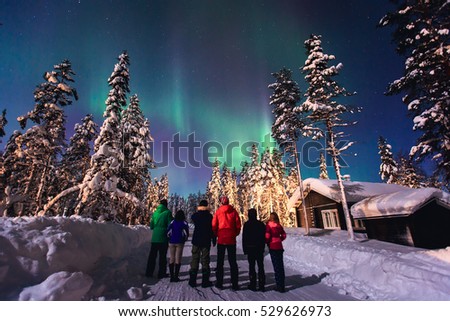 Beautiful picture of massive multicolored green vibrant Aurora Borealis, Aurora Polaris, also know as Northern Lights in the night sky over winter Lapland landscape, Norway, Scandinavia
 Royalty-Free Stock Photo #529626973