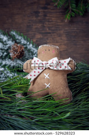 Christmas decoration. Gingerbread man, spruce branches. Studio shooting. Subject shooting.