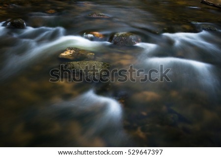 Small rivers with stones in long exposure