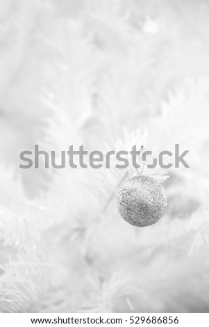 silver glitter ball hang on white christmas tree