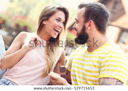 Picture showing young man proposing to beautiful woman outdoors