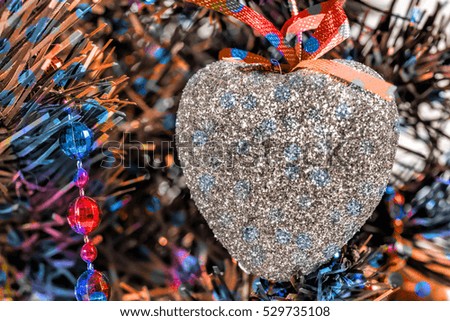 Christmas toys in the form of a silver heart
