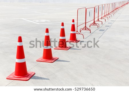 Traffic cone on concrete floor in parking lot