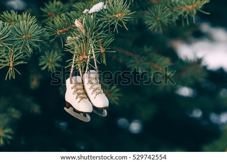 Closeup christmas tree decoration miniature ice skates on the rope