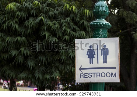 Male Female Restroom Sign with Arrow