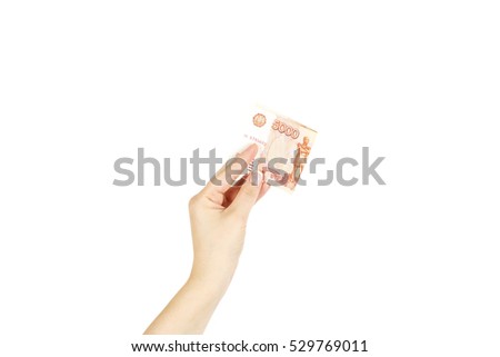 Isolated women's hand holds five thousand roubles on a white background.
