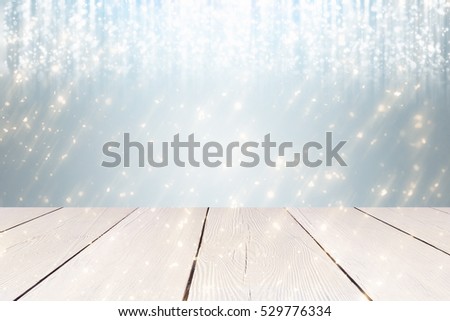 Christmas abstract Silver background with golden round bokeh or circle glitter lights and white table. Use  for display or montage your products