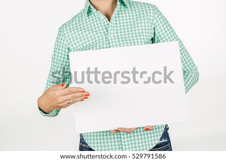 woman wearing holding a white board with empty copy space. image on a white studio background. business and lifestyle concept