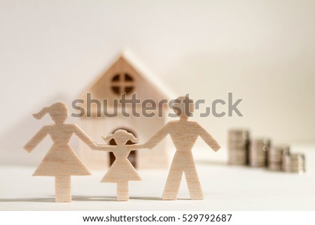A family and home with model and coin stack on paper background, the saving money for real estate owner in the future concept.