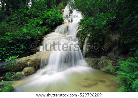 Beautiful waterfall in rainforest , Pawai Waterfall in Tropical rain forest of Thailand , water fall in deep forest of  Phrae province Thailand .