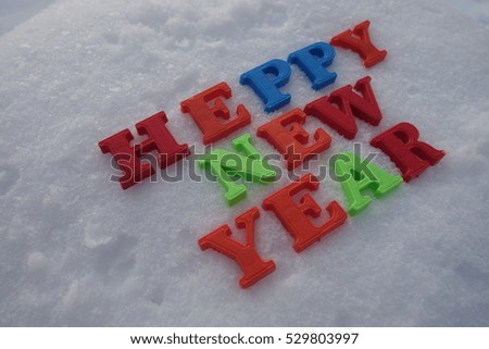 Happy New Year concept. Letters on background. The letters on the white snow.