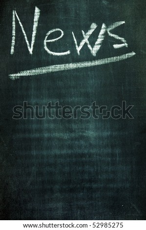 word news written with a chalk on a blackboard