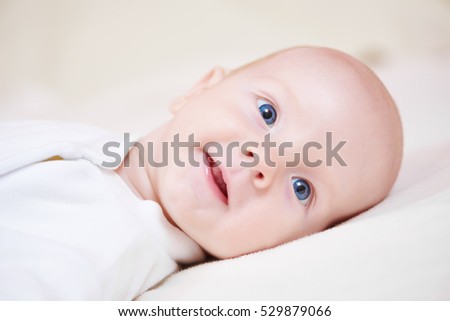 neweborm baby boy smiling