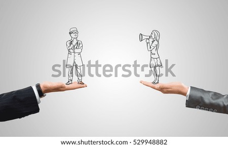 Drawn businesspeople in human palms on gray background