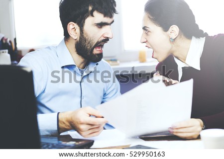 Two angry businesspeople in office Royalty-Free Stock Photo #529950163