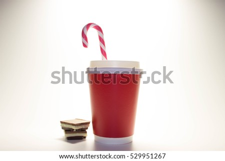Red Christmas cup of coffee can, chocolate bars, candy