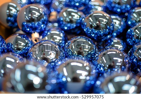 Many Silver glass Christmas balls.Blur, shallow depth of field.
