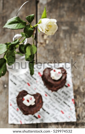 cakes in the form of heart and a white rose.