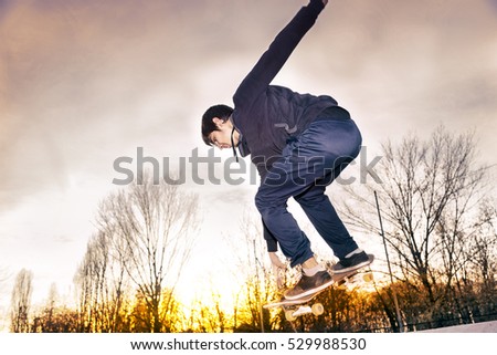young skateboarder jumping on a ramp outdoor