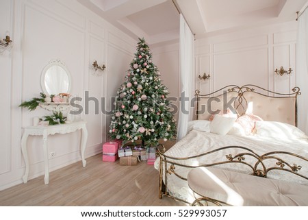 Calm image of interior Classic New Year Tree decorated in a room with bed