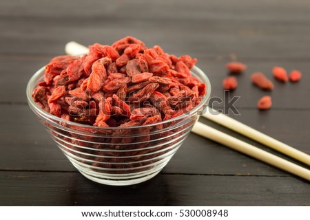 Goji berries in a bowl with Chinese chopsticks