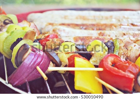 Stock image of close up of grilled beef and chicken kebabs