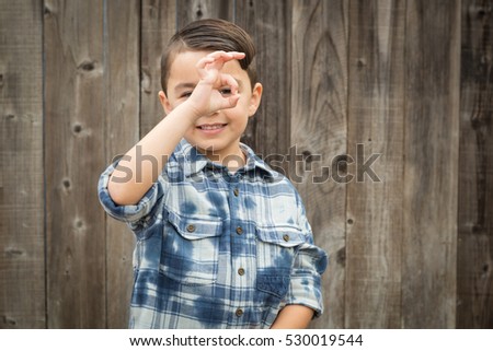 Happy Young Mixed Race Boy Making Okay Hand Gesture.