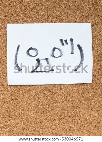 The series of Japanese emoticons called Kaomoji on the cork board, surprise