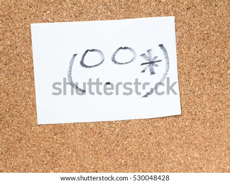 The series of Japanese emoticons called Kaomoji on the cork board, awkward
