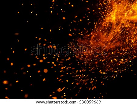 fire flames with sparks on a black background Royalty-Free Stock Photo #530059669
