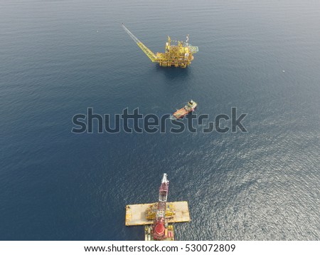 Aerial view of topside installation by heavy lift vessel captured by drone