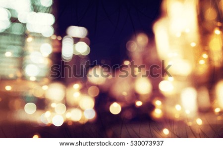 Blurred blue and pink urban building background illuminated at night