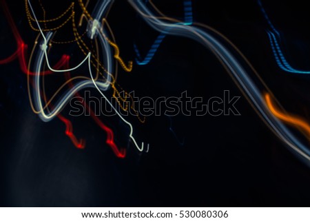 Blurry light effect from small size of multicolor lightbulb on dark background represent the abstract concept related idea.