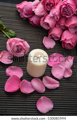 rose flower with petals and candeln a mat background.