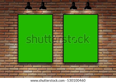 duo green screen frame on brick wall with lamp. nice brick show room with spotlights. 