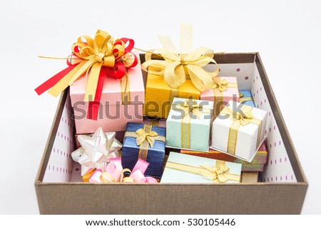Gifts in big box on white background