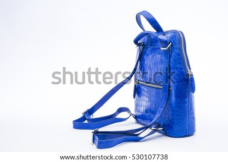 backpack crocodile skin with blue color isolated on white background