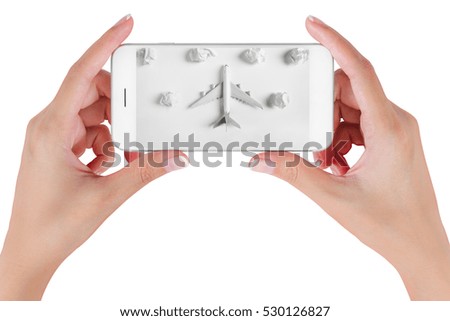 Woman hand using smart phone searching Preparation for Traveling with Airplane model flying among paper clouds. Travel concepts, Isolated on white background.