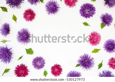 Floral Pattern Frame Border. Composition with Purple and pink Aster (Callistephus chinensis) flowers on white background. Top view. Flat lay.