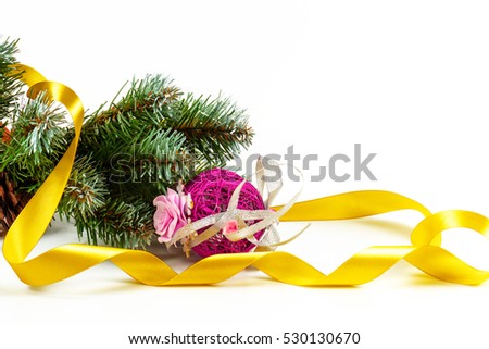 Artificial fir-tree branch with a ball, a background for New year and Christmas on a white background