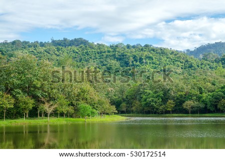 Amazing picture of green mountain landscape with blue sky and white clouds. Great nature scenery of green mountain range under sunlight at the middle of summer day