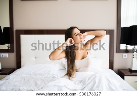 Young beautiful girl wake up in the morning at home