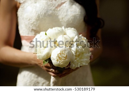 Beautiful bridal bouquet in her hands
