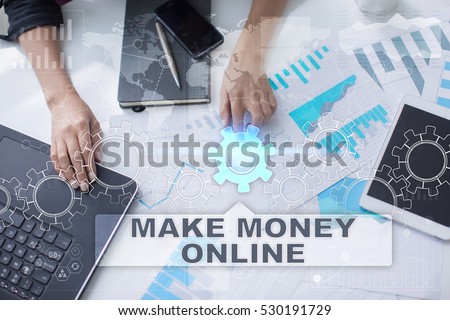 Woman is working with documents, tablet pc and notebook and selecting make money online.