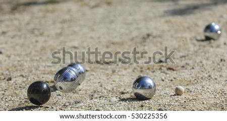Metallic petanque three balls and a small wood jack, France